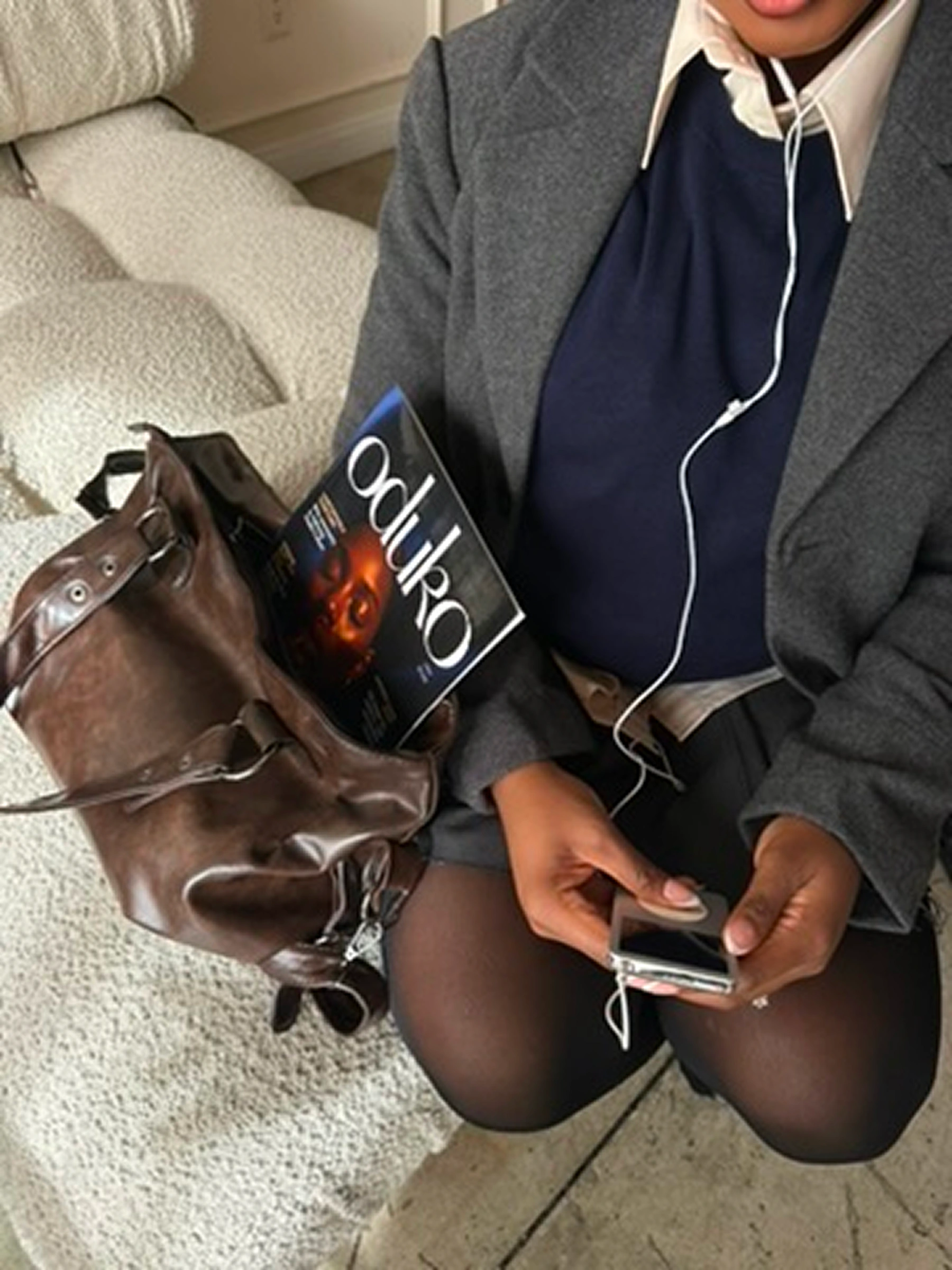 An Oduko Society member holding a community gift bag
